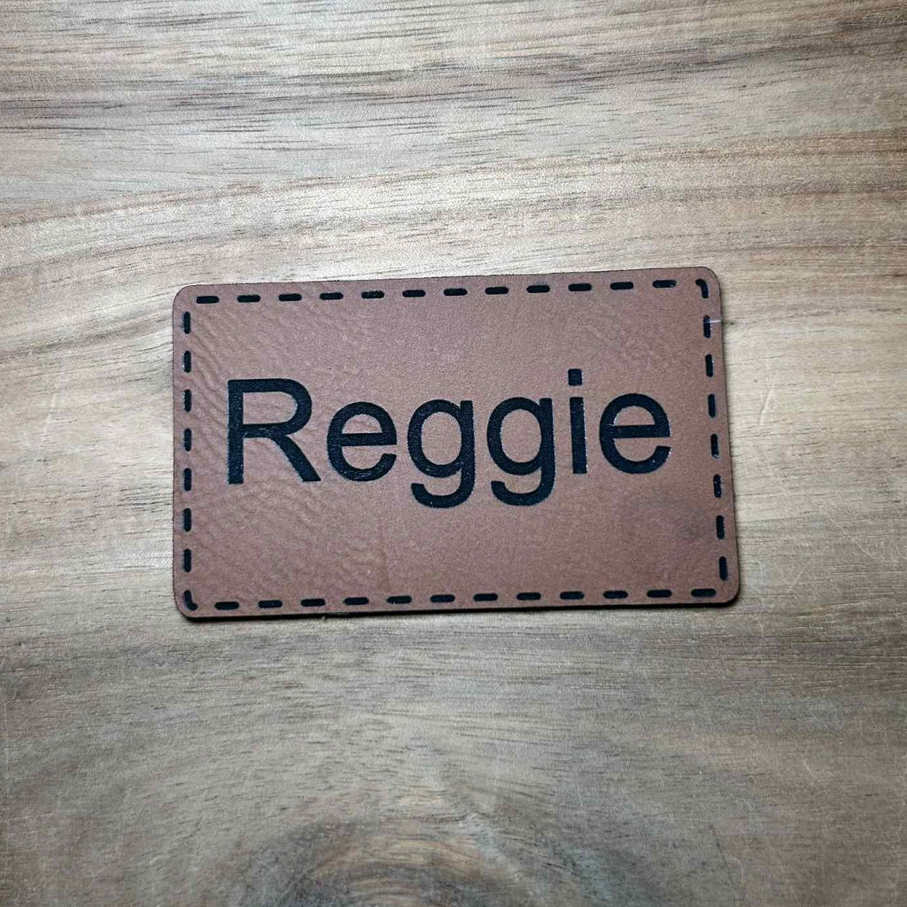 personalized brown leather patch with the name Reggie engraved